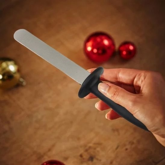 aiguiseur couteau portatif tenu main ambiance noel
